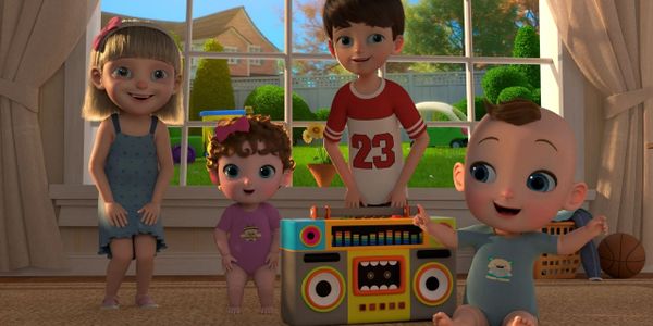 Four animated children happily playing indoors with a colorful boombox.
