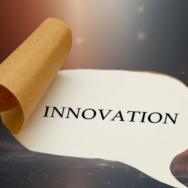 Paper revealing the word 'INNOVATION'.