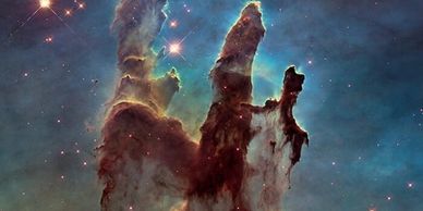 The Pillars of Creation in the Eagle Nebula, a stunning cosmic gas and dust formation.