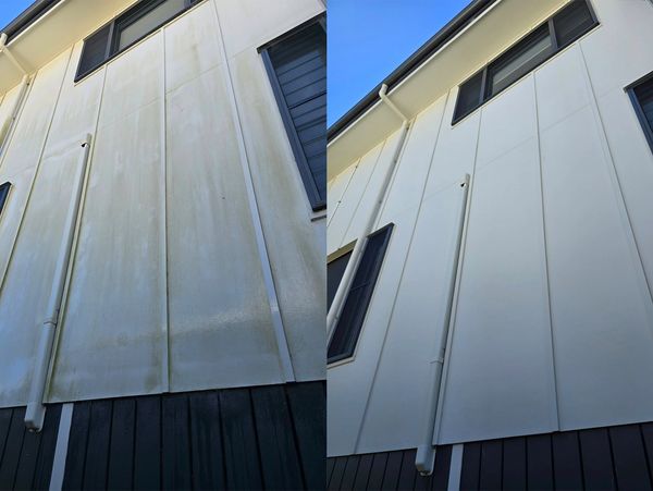 Before and after cleaning of a white building exterior showing significant improvement.