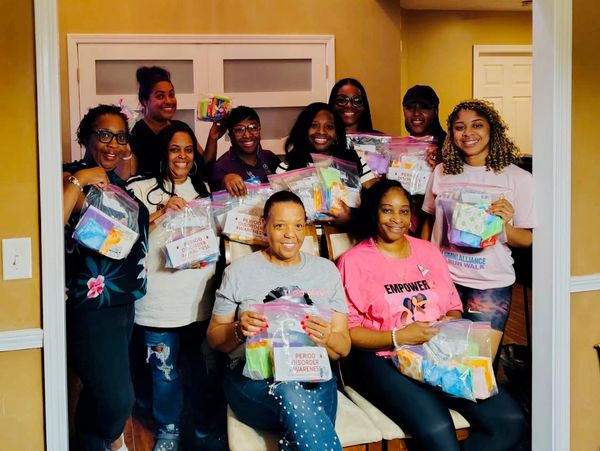 Group holding hygiene and awareness kits.