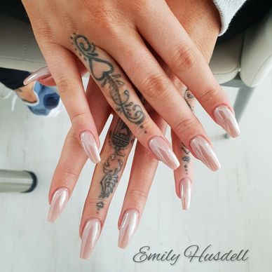 Emily Husdell nail service - picture of pink chrome nail set - model has lovely tattoos on hands
