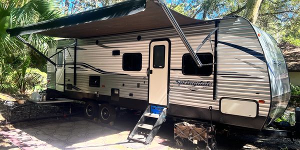 Keystone Springdale bumper pull RV trailer at Hanna Park campsite with full RV hookups