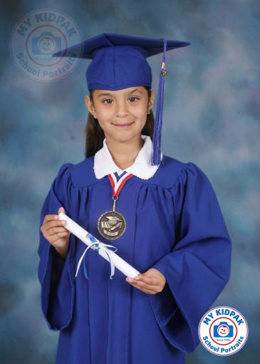 Young girl in blue graduation gown holding diploma and medal.