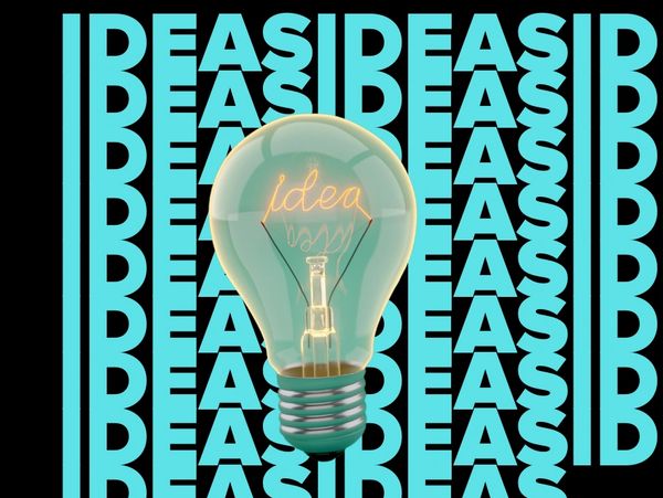 Light bulb glowing with the word 'idea' amidst repeating 'IDEAS' text.