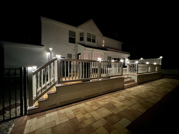 Night pic of finished deck project.  Make your yard shine by adding  accent lighting to your project