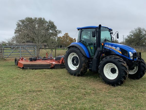 New Holland Powerstar 120 with a Rhino 3150 Batwing Shredder