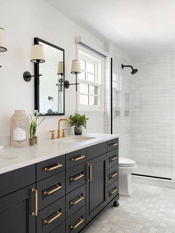 Full Bath Remodel with a black vanity and gold hardware.
Kohler
Delta
Sterling
Shower trim
Faucet

