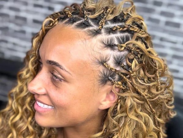 Small bohemian braids, mid-back honey-golden blonde blend style by Jartu’s Braids Beauty Bar.