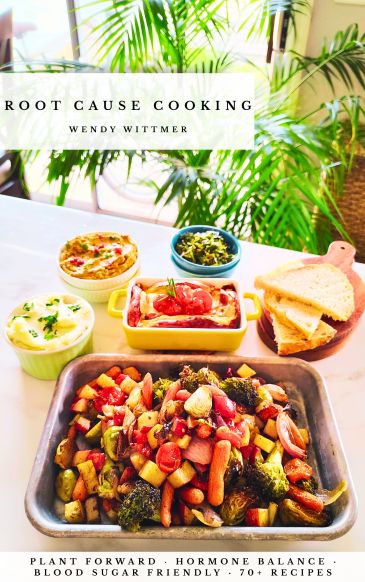 Assorted cooked vegetable dishes and bread on a table.