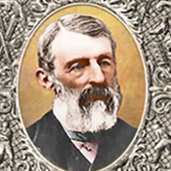 Portrait of an elderly man with a white beard in an ornate frame.