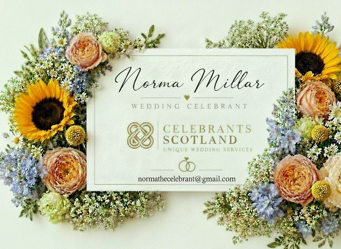 Elegant wedding celebrant card surrounded by vibrant flowers.