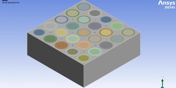 3D simulation of a block with multiple colored circular regions using Ansys software.