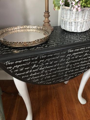 Queen Anne table with French script mesh stencil on top.