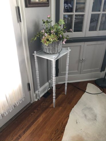 Marble top plant stand finished with white lacquer.
