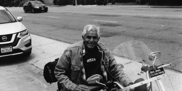 A man on his motorcycle. Can’t get more simplistic than that. 