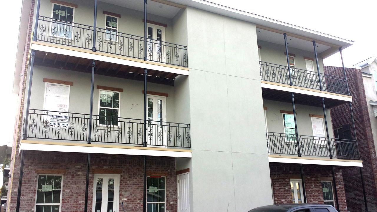trhee story building with iron balcony railings
