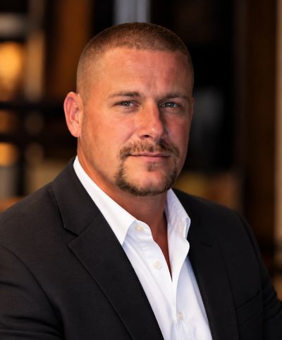 Confident man in suit posing for a portrait.