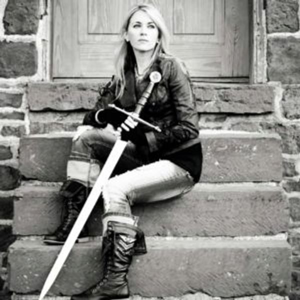 A black and white picture of the woman holding a knife