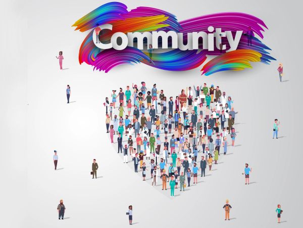 Diverse people forming a heart under the word 'Community'.