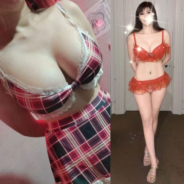 Two women in revealing lingerie poses, one in plaid and the other in red.