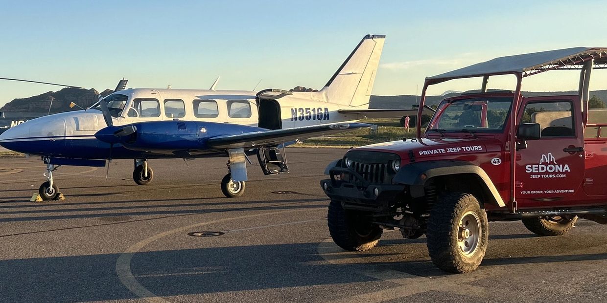 Jeep and airplane on tarmac