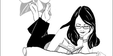 Woman with glasses writing in a notebook while lying down.
