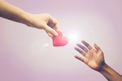 Hands reach out to help each other with caring and support as a symbol for a support group