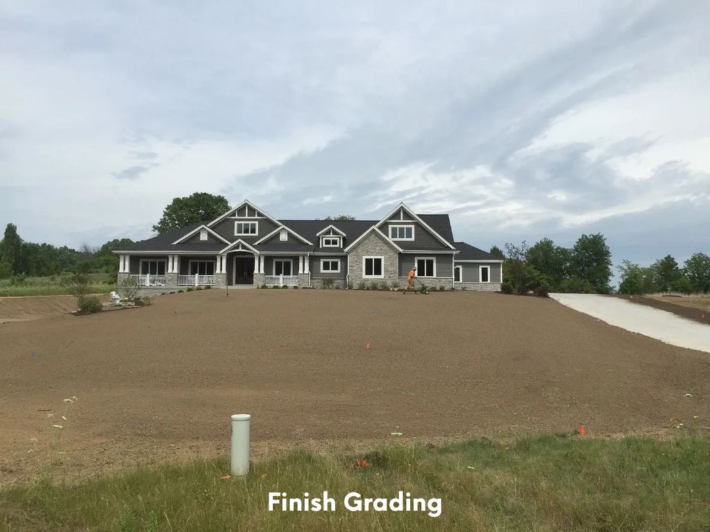 Finish grading yard smooth