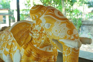 yellow colour filled in wooden elephant 