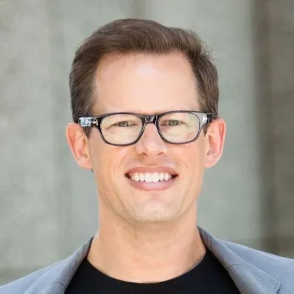 Smiling businessman with glasses