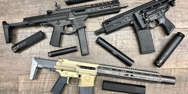 Collection of short barreled rifles, PCCs and suppressors.