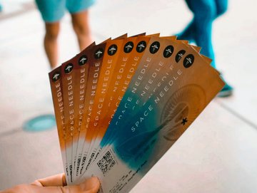 Image of a person holding lots of tickets to show Sales Review and Training
