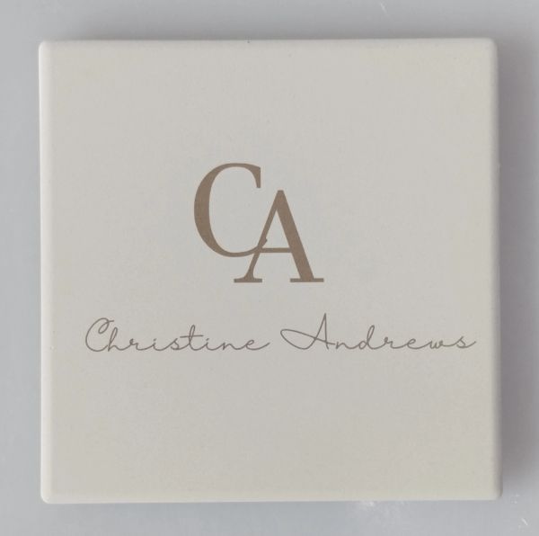 Square white tile with CA logo and Christine Andrews lettering.