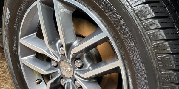 Close-up of a Jeep car wheel and tire with detailed tread.