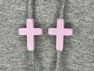 Lavender cross charms on sweatshirt drawstrings