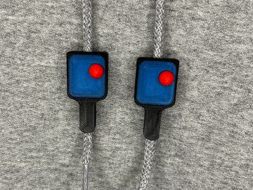 Pickle pall paddle in black and blue on sweatshirt drawstring.