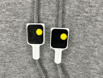 Pickle ball paddle charms on sweatshirt drawstring