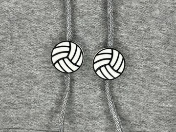 Volleyball charm in black and white on sweatshirt drawstring.