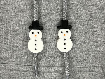 Snowman charms on sweatshirt drawstring
