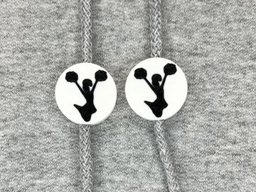 Silhouetted cheerleader charm in white and black on sweatshirt drawstring.