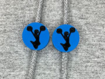 Silhouetted cheerleader charm in royal blue and black on sweatshirt drawstring.