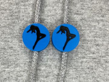 Silhouetted dance charm in royal blue and black on sweatshirt drawstring.