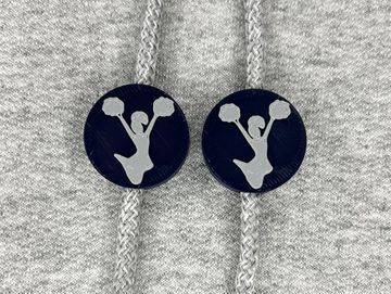 Silhouetted cheerleader charm in navy blue and gray on sweatshirt drawstring.
