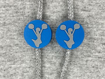 Silhouetted cheerleader charm in royal blue and gray on sweatshirt drawstring.