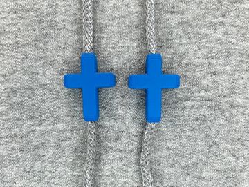 Royal blue crosses on a grey sweatshirt