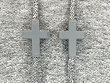 Grey crosses on a grey sweatshirt