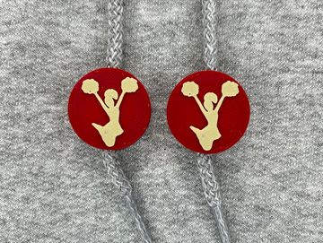 Silhouetted cheerleader charm in crimson red and vegas gold on sweatshirt drawstring.
