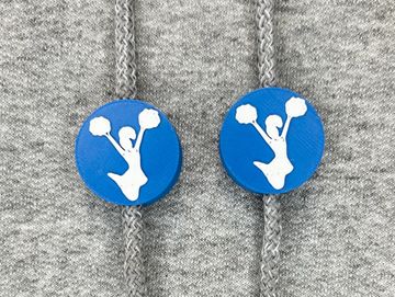 Silhouetted cheerleader charm in royal blue and white on sweatshirt drawstring.
