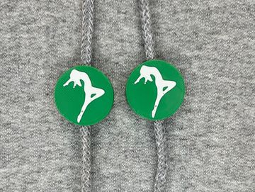Silhouetted dance charm in kelly green and white on sweatshirt drawstring.